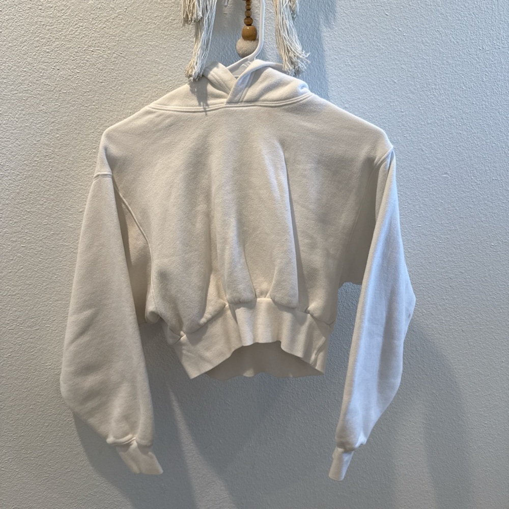 TNA cropped sinched hoodie. Small stains pictured located in back of sleeve.